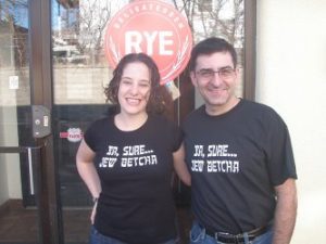 Leora with Rye Deli Co-Owner David Weinstein, sporting TC Jewfolk's new "Ya, sure ... Jew Betcha" T-shirts