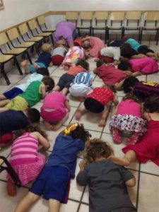 Kindergartners north of Tel Aviv take cover. Courtesy of the Jewish Federations of North America.