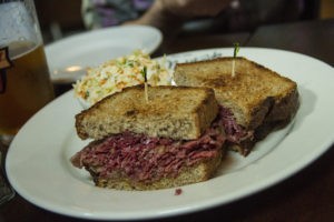 The 7-oz "Minnesota-style" pastrami sandwich with a side of slaw.