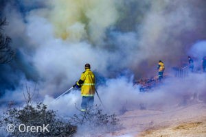 Firefighters try to put out flames in southern Israel.