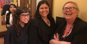 Carin Mrotz, Migdalia Loyola, and Carla Kjellberg at the Iftar in the Attorney General's office in the State Capitol on the first night of Ramadan.