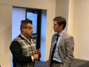 Attorney General Keith Ellison and Minneapolis Mayor Jacob Frey talk before the start of the listening session.