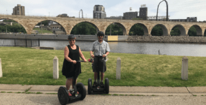 Cantor Audrey Abrams and her husband, David, on a Segway tour of Minneapolis on July 1, 2020 -- her first day of retirement (Photo Courtesy of Cantor Abrams)