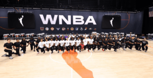 WNBA players in Bradenton, Fla., stand united before the league canceled games in protest on Aug. 26. (Photo courtesy WNBA Twitter)