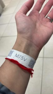 Alexandra Sakurets's bracelet that let her in to the mall to help refugees in Przemysl, Poland.
