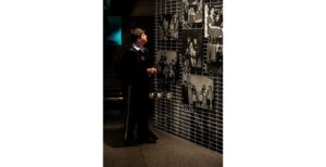 Capt. Nic Wiswell of the Minnesota National Guard looks at an exhibit at the U.S. Holocaust Memorial Museum. (Ethan Roberts Photography/JCRC)