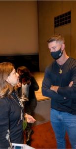 Laura Zelle, the JCRC's director of Holocaust education, talks with Minnesota Vikings kicker Greg Joseph. (Ethan Roberts Photography).