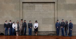 Members of the Minnesota National Guard stand outside the U.S. Holocaust Memorial Museum next to a famous quote from Gen. Dwight D. Eisenhower (Ethan Roberts Photography/JCRC)
