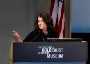 Susie Greenberg, the associate director of Holocaust education at the JCRC, talks to the traveling group before starting the tour. (Ethan Roberts Photography.JCRC).