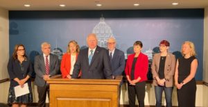 Gov. Tim Walz with Lt. Gov. Peggy Flanagan, Sen. Steve Cwodzinski, Rep. Emma Greenman, Rep. Frank Hornstein, Sen. Sandy Pappas, Rep. Sandra Feist, and Rep. Heather Edelson at a press conference at the Minnesota State Capitol on Friday, Aug. 26.