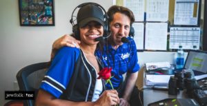 Sean Aronson (left) with The Bachlorette, Michelle Young, in the St. Paul Saints broadcast booth.