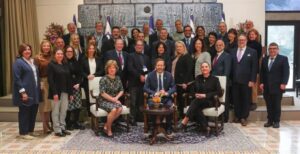 Beth Kieffer Leonard (middle row, far left) and Jim Cohen (middle row, second from right) with the JFNA delegation and Israel President Isaac Herzog. (Photo courtesy JFNA).