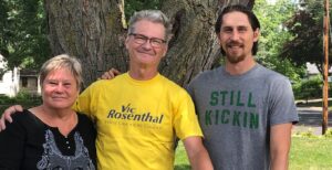 Michael Kuhne (center) prior to his bike ride around Minnesota with the widow and son Vic Rosenthal, Chris Rosenthal (left), and Aaron Rosenthal.