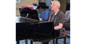 John Orenstein plays piano at a recent rehearsal for his Minnesota Fringe Festival show.