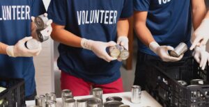 volunteers sorting cans