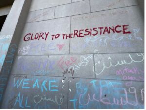 Graffiti reading "Glory To The Resistance" on the walls of Coffman Union on the campus of the University of Minnesota.