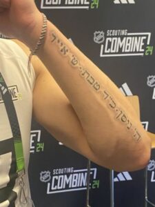 Zeev Buium's tattoo with the Hebrew dates of the Hebrew dates of his winning gold medals for Team USA at the World Under-18 Championships and the World Junior Championships, and his national title at Denver. (Twitter/X Photo by Adam Kimelman/@NHLAdamK)