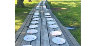 An empty Shabbat table at Herzl Camp earlier this summer to honor the hostages held by Hamas. (Courtesy)