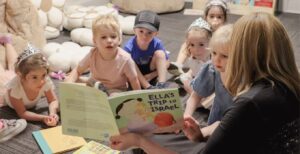 A teacher reads her students at the Jewish Beginnings preschool in Minneapolis (Courtesy/Photo by Michele Pikovsky)