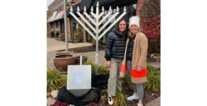 Lauren Sundick and Hennepin County Commissioner Heather Edelson at the Hanukkah display at Edina's 50th and France district. (Courtesy).