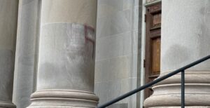 The remnants of a swastika on the column of Temple Israel's historic Emerson Avenue entrance. (Lonny Goldsmith/TC Jewfolk)