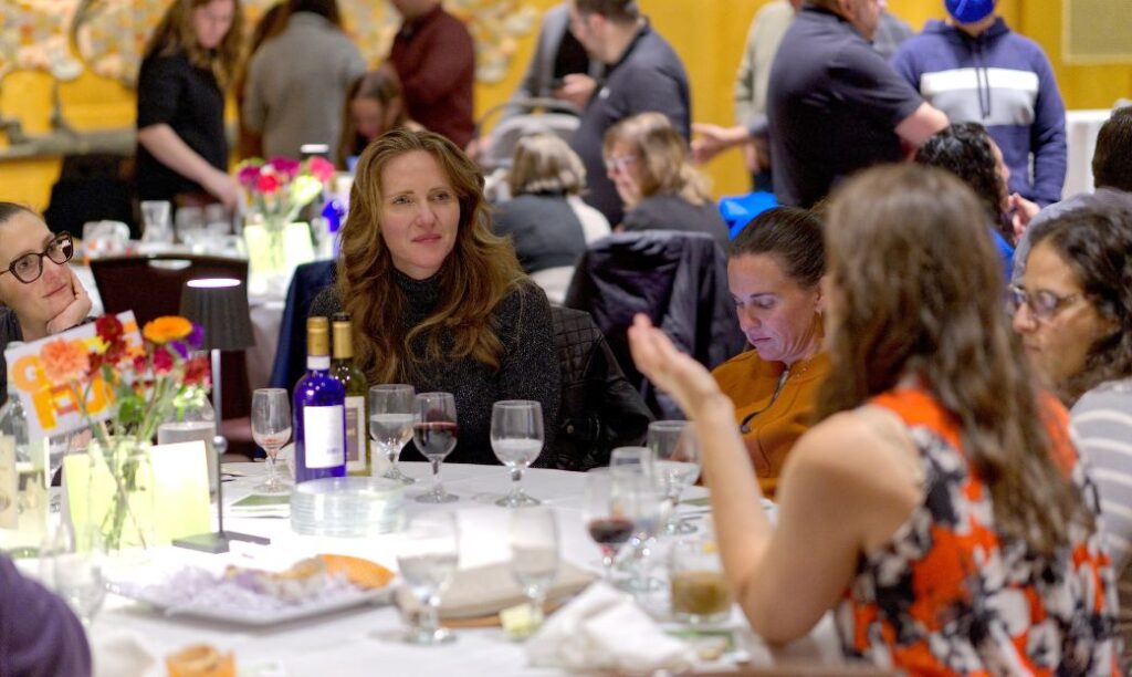 A group dining at Sukkotgiving (Lev Gringauz/TC Jewfolk)