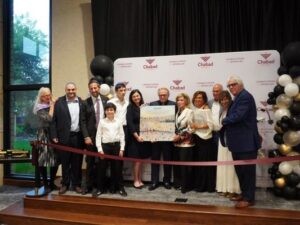 Allan Stillerman (center) and his family are honored for the naming donation of the campus for the Minneapolis Chabad Center for Jewish Life. (Lonny Goldsmith/TC Jewfolk).