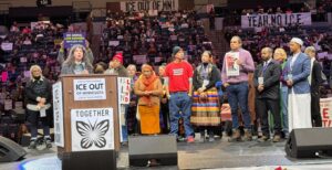 Rabbi Arielle Lekach-Rosenberg speaks to the crowd at the Jan. 23 "ICE Out of Minnesota" rally at Target Center. (Molly Rosenblatt/TC Jewfolk).
