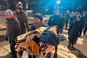 Macalester's Jewish community leads a processional to Weyerhauser Chapel, where the Torah now resides. (Molly Rosenblatt/TC Jewfolk)