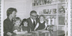 Essay author Heidi Schneider (middle) with mother Dori Schneider, sister Kate Schneider, father Carl Schneider, and youngest sister Maria Schneider in the family's Cold War-era bomb shelter in Windom, Minn. (courtesy)