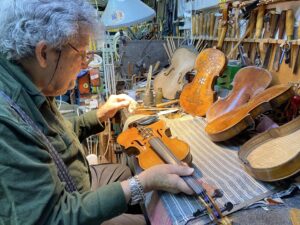 Amnon Weinstein z'l working on rehabilitating a violin.