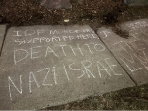 Chalk calling for "Death to Nazi Israel" was written outside UMN Chabad.