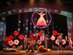 (Top) Becca Claire Hart. (Bottom) Aniya Bostick, Dean Holt, Reed Sigmund, and Regina Marie Williams in Children's Theatre Company's 2026 production of 'The Wizard of Oz.' (Photo by Glen Stubbe Photography)