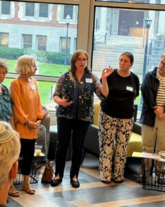 Cantor Rachel Stock Spilker, Maaynot's founder and board president, talks to the group. (Juliana Sellers/Jewfolk).