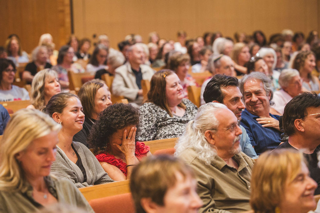 The audience enjoying a story