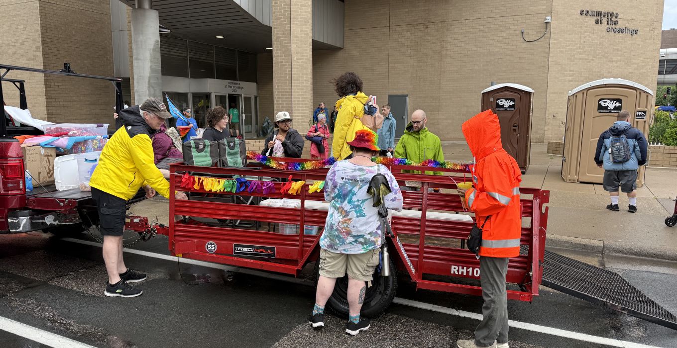 A group of J-Pride volunteers decorate the trailer for the Pride Parade.