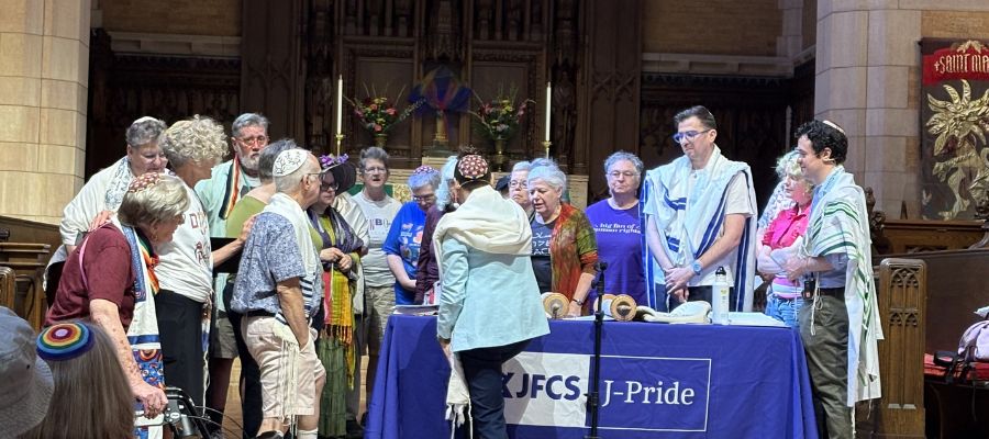 Jewish LGBTQ elders go up for an aliyah during Saturday's J-Pride Shabbat service (photo courtesy JFCS)