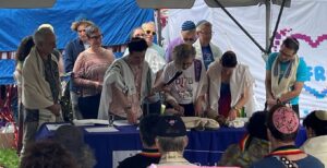 Members of the Jewish community read Torah at last year's Pride Shabbat at Twin Cities Pride. (courtesy)