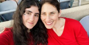 a mother and daugther smiling taking a selfie